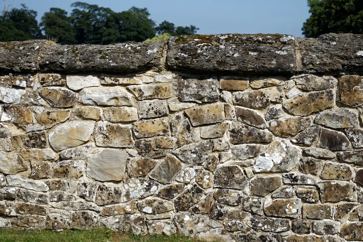 A stone wall finished with copings